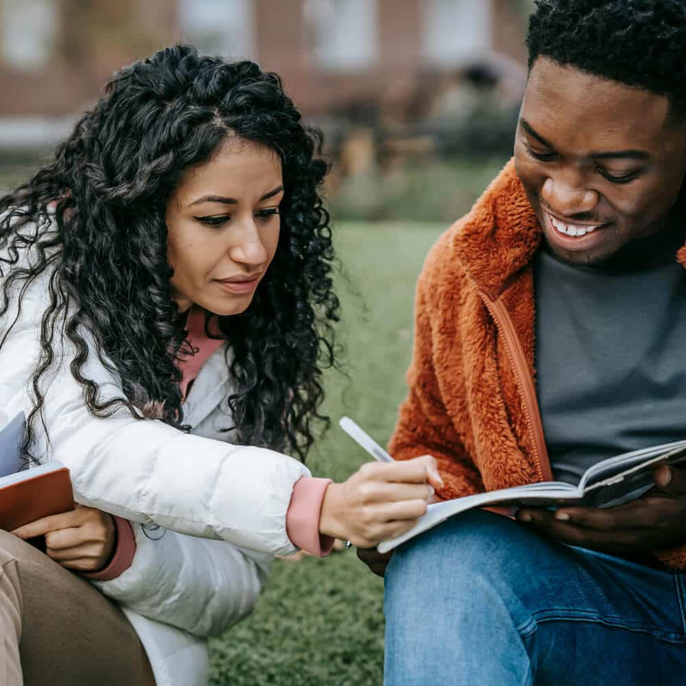 Couple discussing parenting arrangements during family mediation session